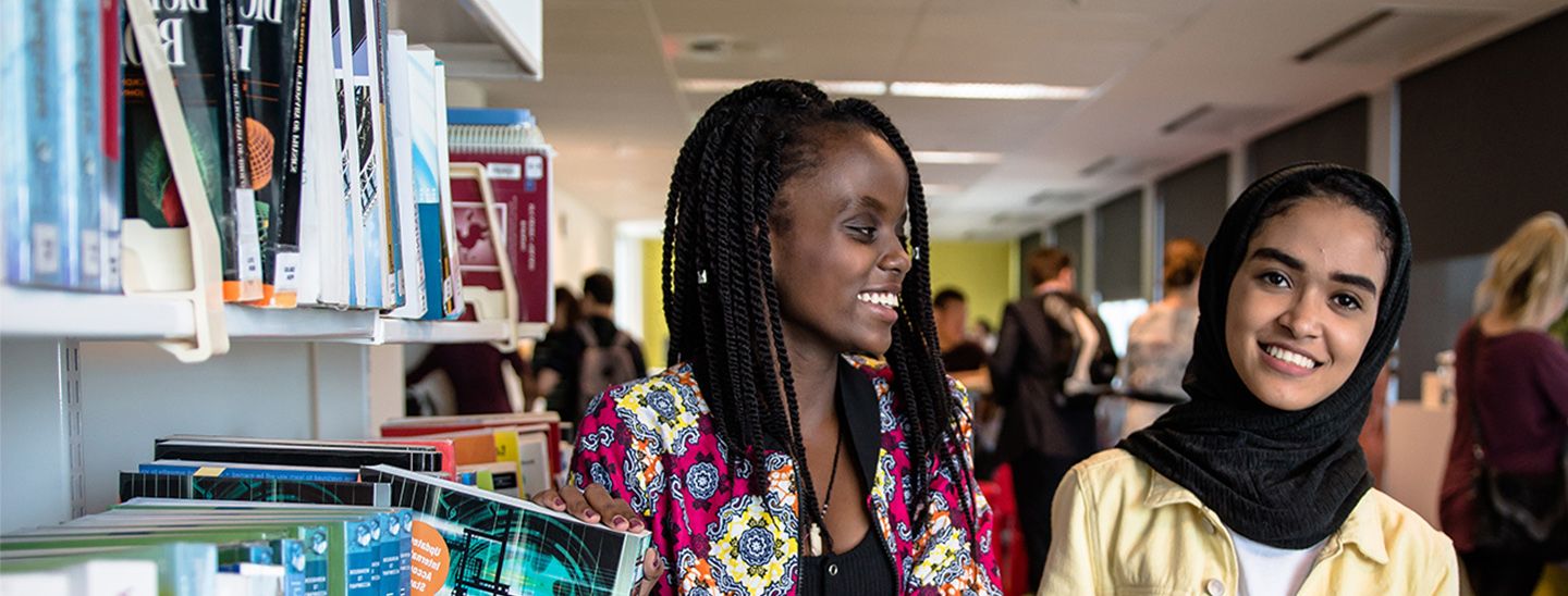 girls with books in college