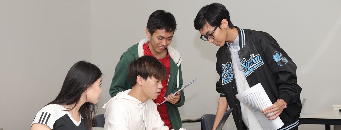 students discussing something in classroom