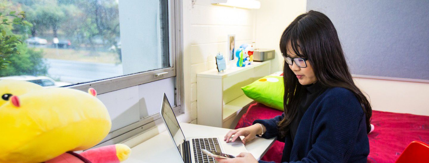 Female on phone and computer