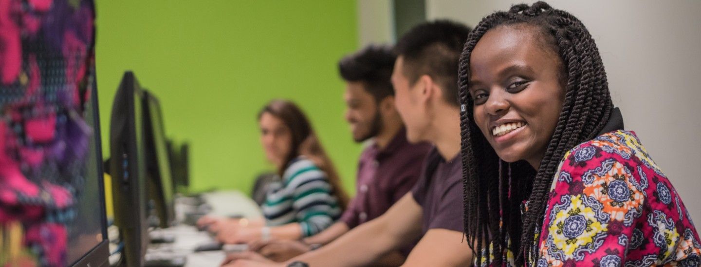 Female smiling in class