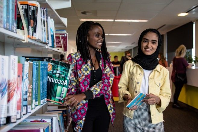 Females holding books