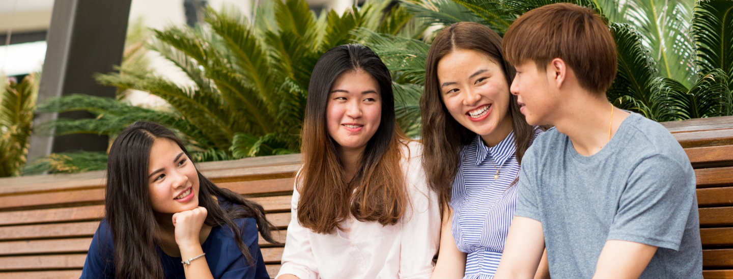 Group sitting and smiling