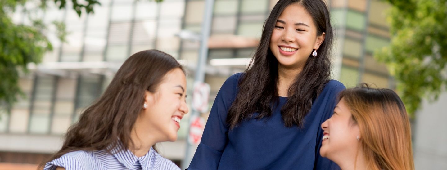 Group sitting and smiling