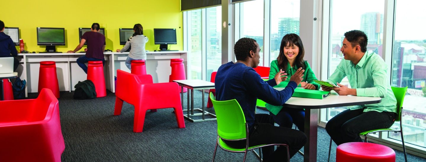Group sitting and smiling