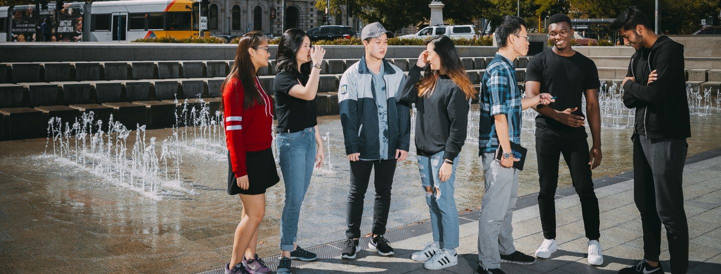 Group standing in front of fountain