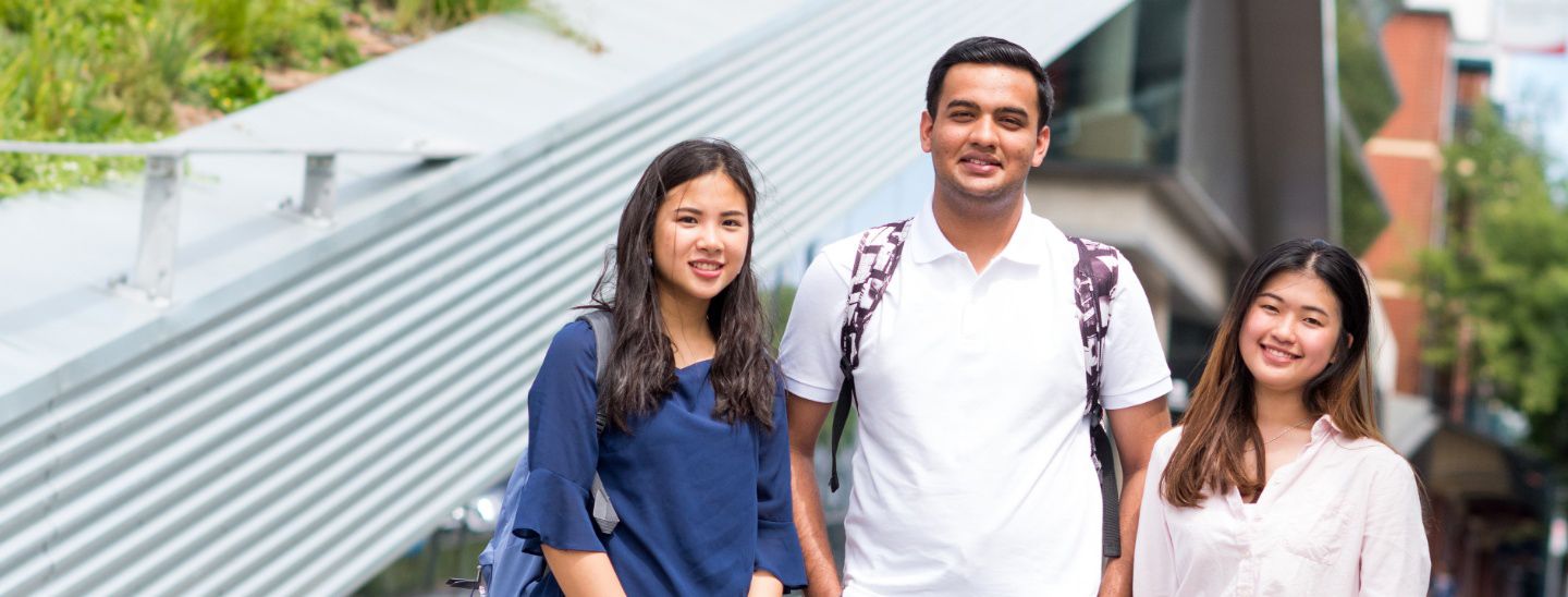 Group standing outdoors smiling