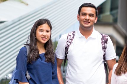 Group standing outdoors smiling