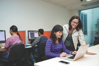 Teacher helping student