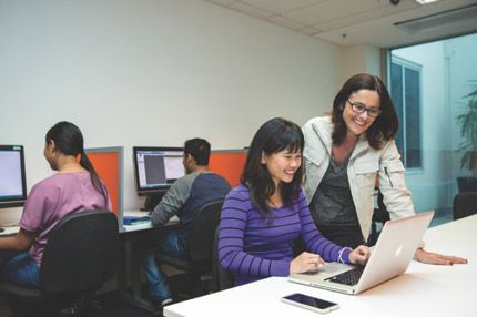 Teacher helping student