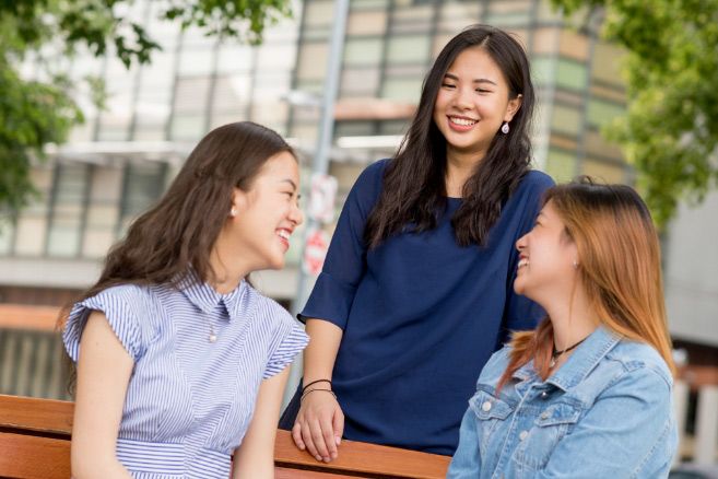 Standing and smiling