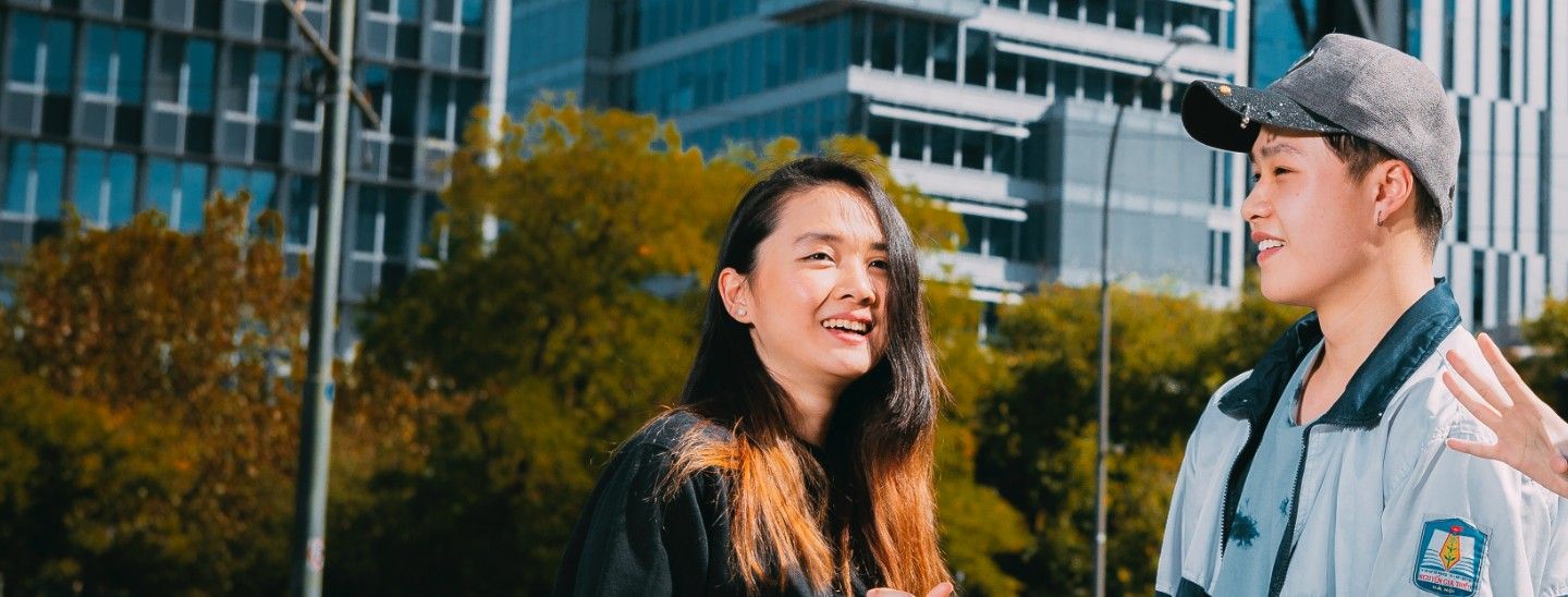 Female and male standing outdoors