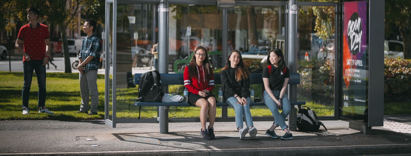 Group sitting in bus stop