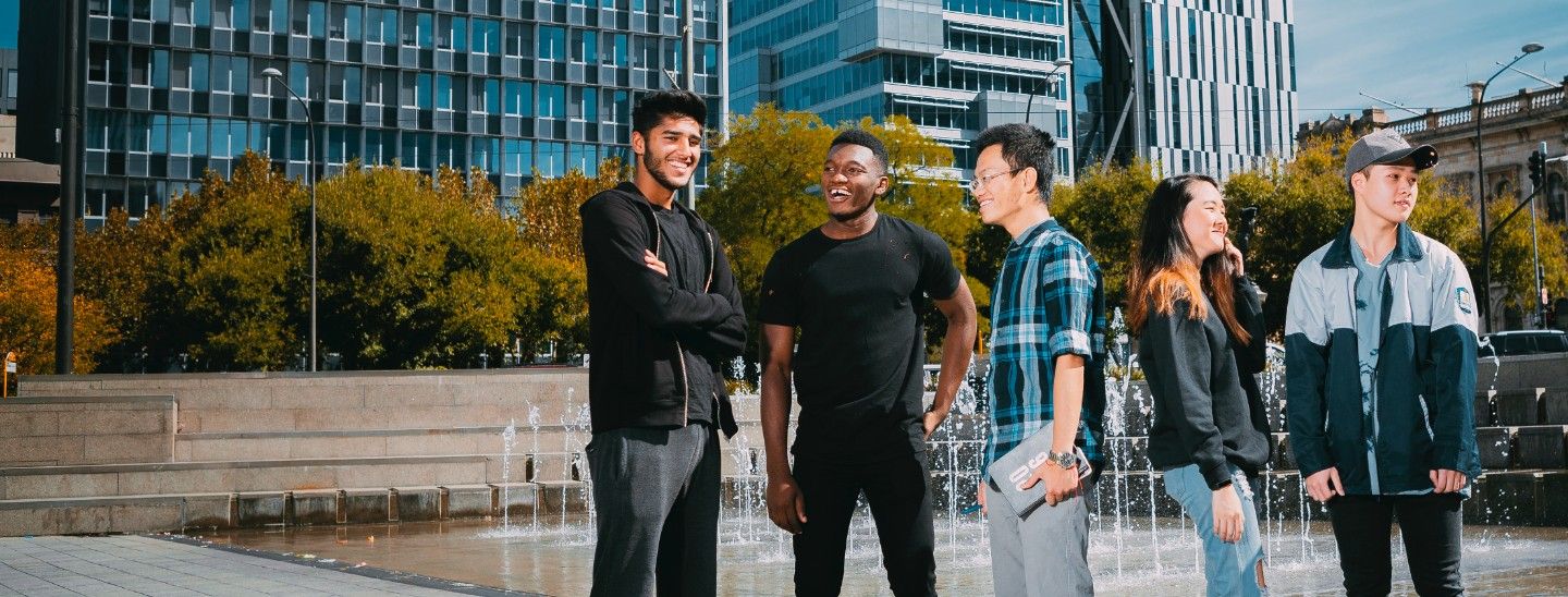 Group standing near pond